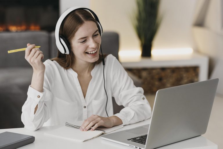 happy-teacher-talking-with-her-students-online